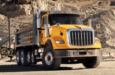 Yellow HX Series Dump Truck At Construction Site